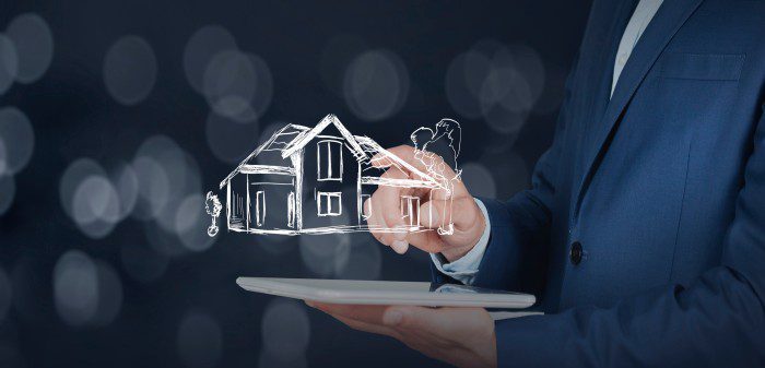 Person using a laptop with an AI hologram